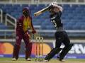 Glenn Phillips hits a six in New Zealand's 90-run win in the second T20 against the West Indies. (AP PHOTO)