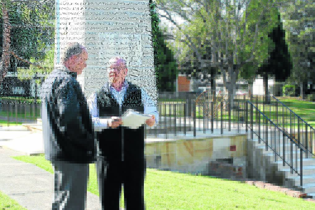 Cultural heritage award nominee: Darcy Elbourne from the Taree RSL?Sub-branch and Tidy Towns assessor Rick Wiezel at the memorial clock.