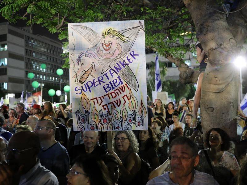 Israelis have rallied against a law that would give PM Benjamin Netanyahu immunity from prosecution.
