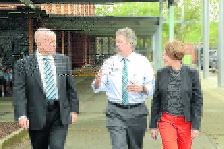 Minister for Education Adrian Piccoli discussing the strategy with director of Connected Communities Peter Sheargold and member for Port Macquarie, Leslie Williams at Taree Public School yesterday. Mr Piccoli accompanied Mrs Williams to Lake Cathie to turn the first sod for the new public school.