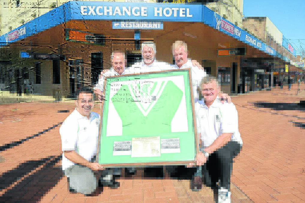 Go the Greens: Gabriel Darzi, one of the major sponsors of the Taree United reunion, organising committee member Kevin Hardy, sponsors Maurie Stack and Gary Rollings and committee member Errol Ruprecht with a framed jumper from the club s inaugural premiership year of 1971. Hardy and Ruprecht were members of the team.