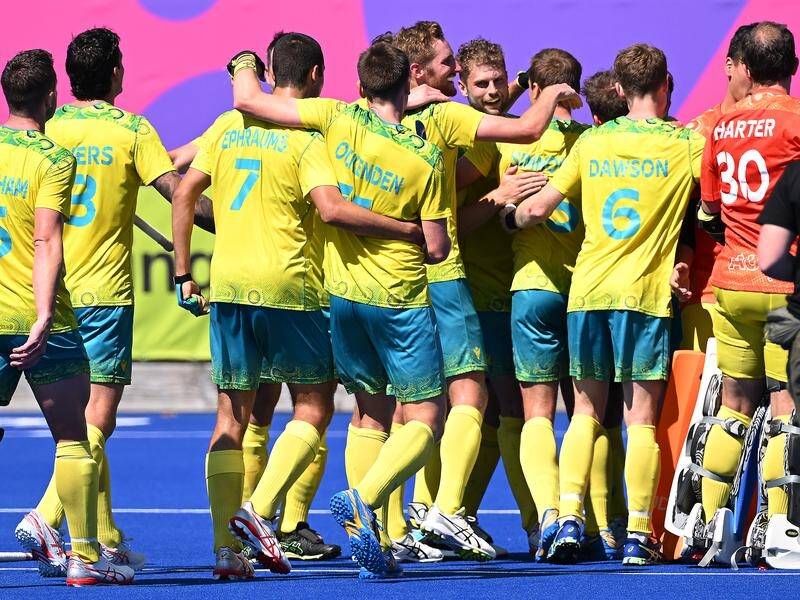 Australia players celebrate their gold-medal winning victory over India at the Commonwealth Games. (Dean Lewins/AAP PHOTOS)