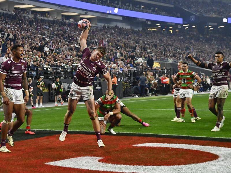 Reuben Garrick celebrates his try in Manly's win over Souths in the NRL season opener in Las Vegas. (AP PHOTO)