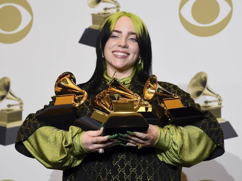 Billie Eilish with her haul of Grammy awards.