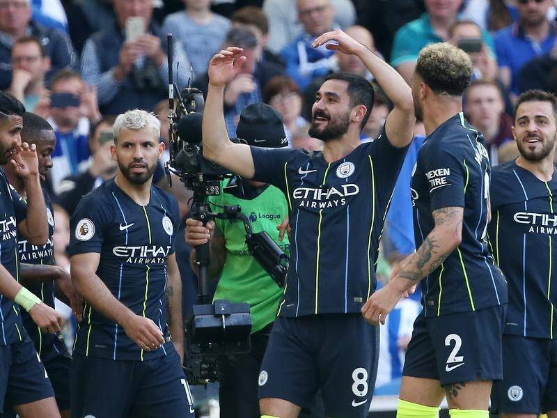 Manchester City have pipped Liverpool to the Premier League title by beating Brighton 4-1.