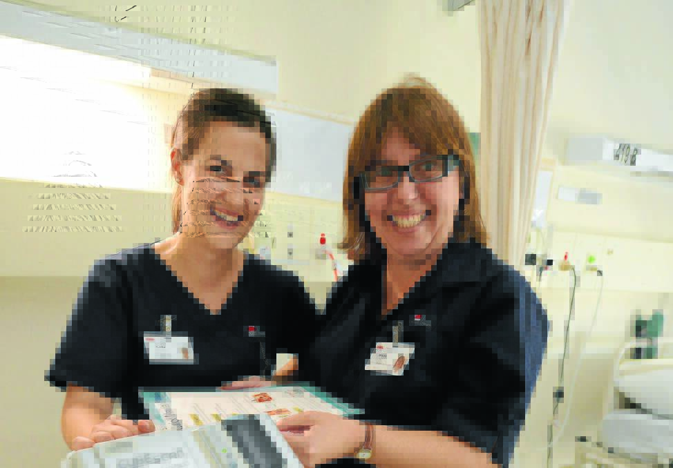 Nursing graduate Carla Rollason with clinical nurse educator Maria Relf at Manning Hospital.