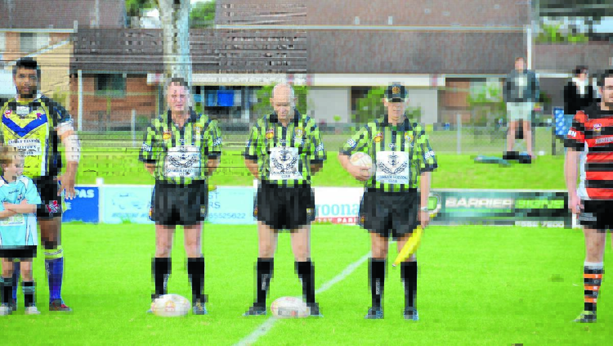 Suspended referee Wayne Archer flanked by touch judges Graham Green and Ken Fuller before a Group Three Rugby League game last season.
