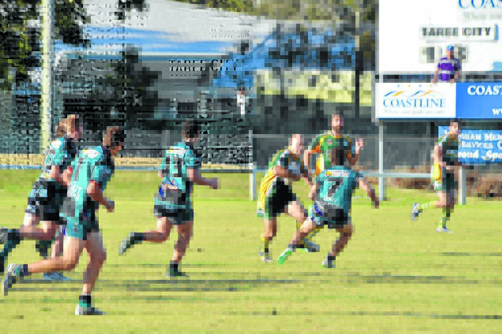 Dean Basham takes the ball up for Forster-Tuncurry during the recent Group Three Rugby League game against Taree City. Basham will retire after Saturday's clash against Wauchope at Tuncurry.