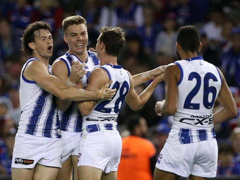 North Melbourne scored a much-needed 25-point AFL win over the Bulldogs to farewell Brad Scott.