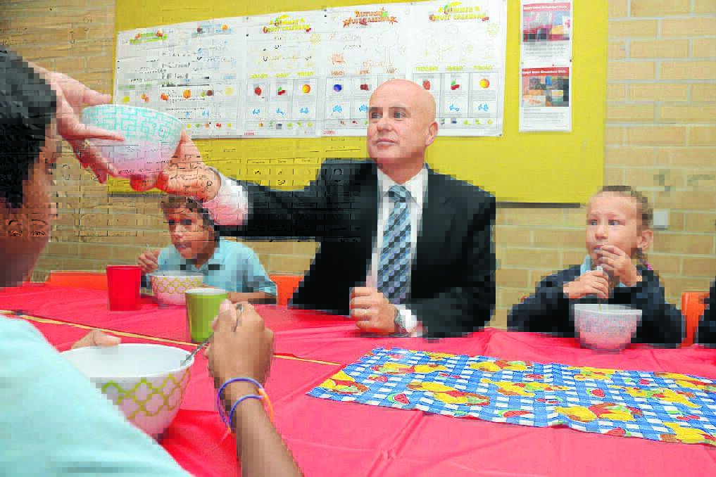 Minister for Education, Adrian Piccoli enjoying breakfast with some Taree Public School students on his recent visit to the school.