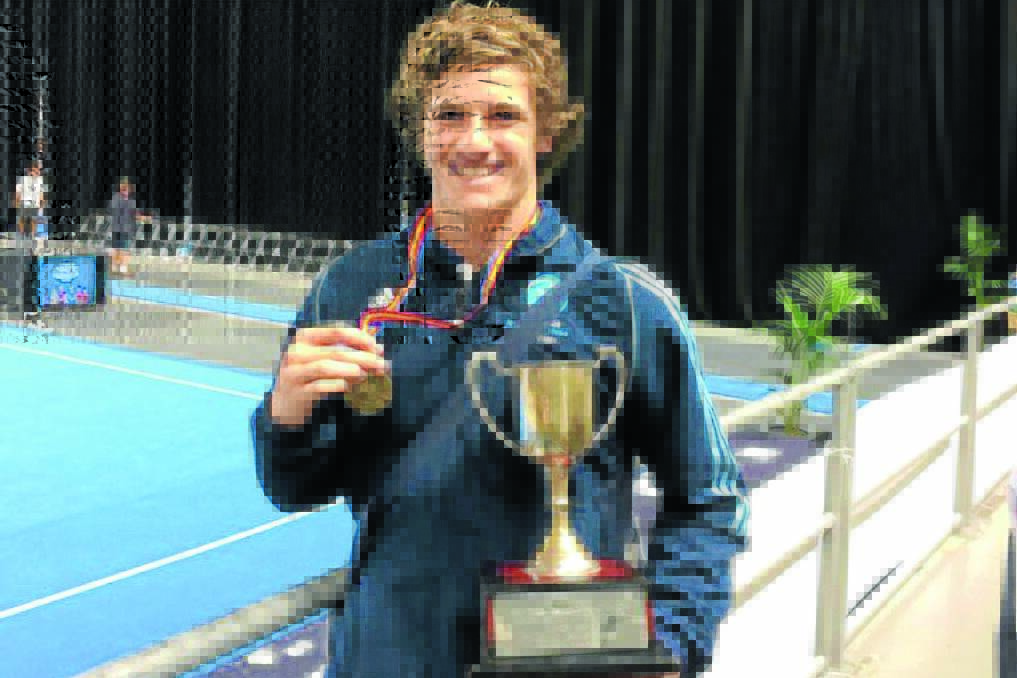 Daniel Stocks with his trophy and gold medal following his Australian under 17 short track tumbling win in Melbourne.