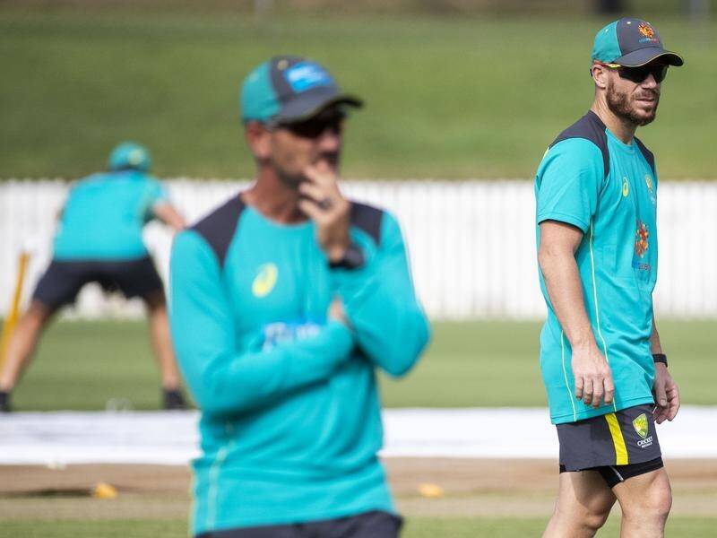 Australia coach Justin Langer (foreground) has welcomed David Warner back to the fold in Brisbane.