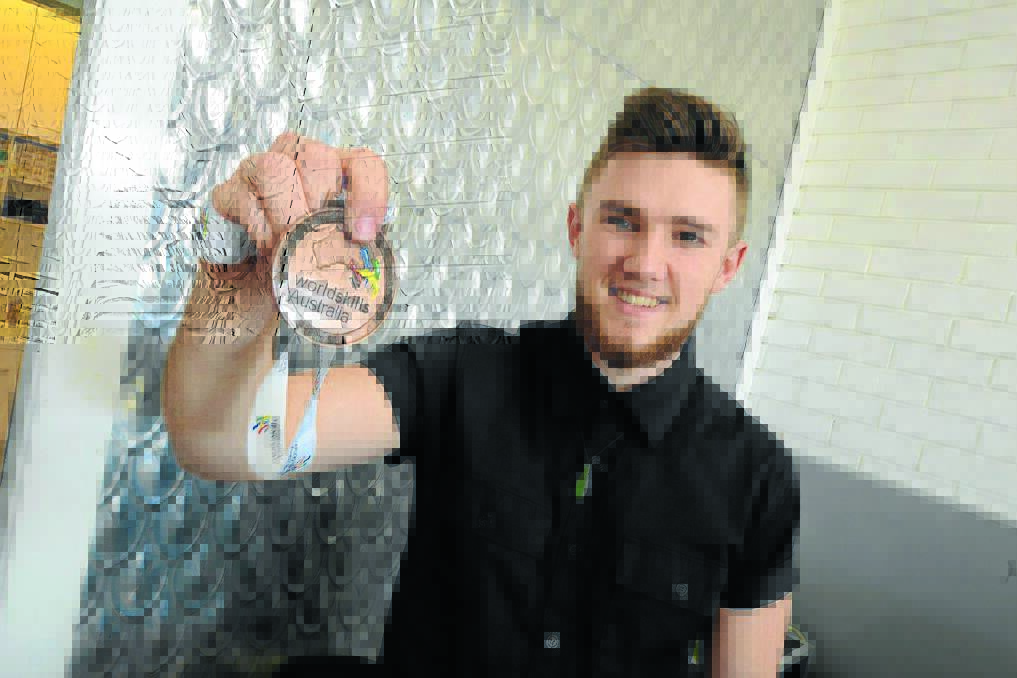 Hairdresser Jake Putan is back at work after putting in a bronze medal winning performance at the WorldSkills Australia National Competition in Perth.