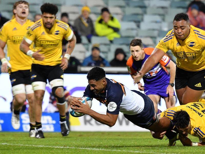 Irae Simone scores a try for the Brumbies who beat the Hurricanes in the Super Rugby Pacific QF.