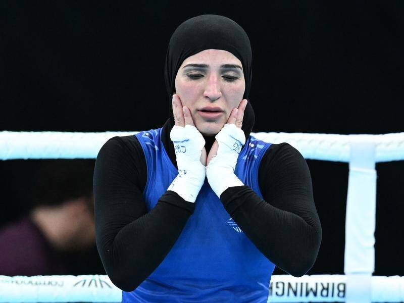 Tina Rahimi was the picture of disappointment after hearing the verdict in her boxing semi-final. (Darren England/AAP PHOTOS)