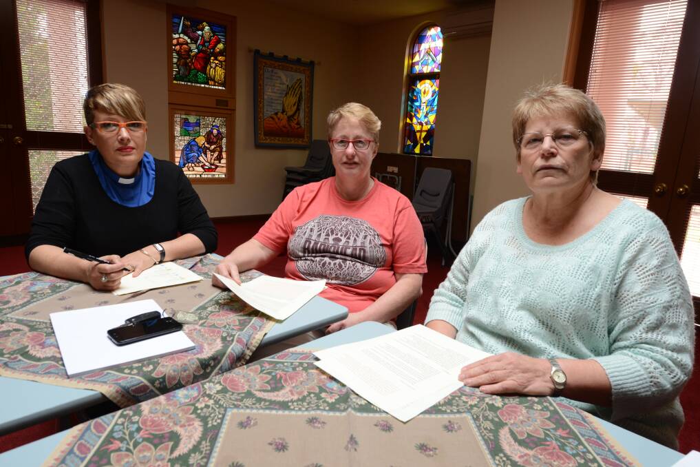 Reverend Helen Holliday, with parishioner Denise Ryan and Reverend Narelle Penman are in the process of penning a letter for Dr David Gillespie to highlight concerns of the Manning religious community, about the federal budget.
