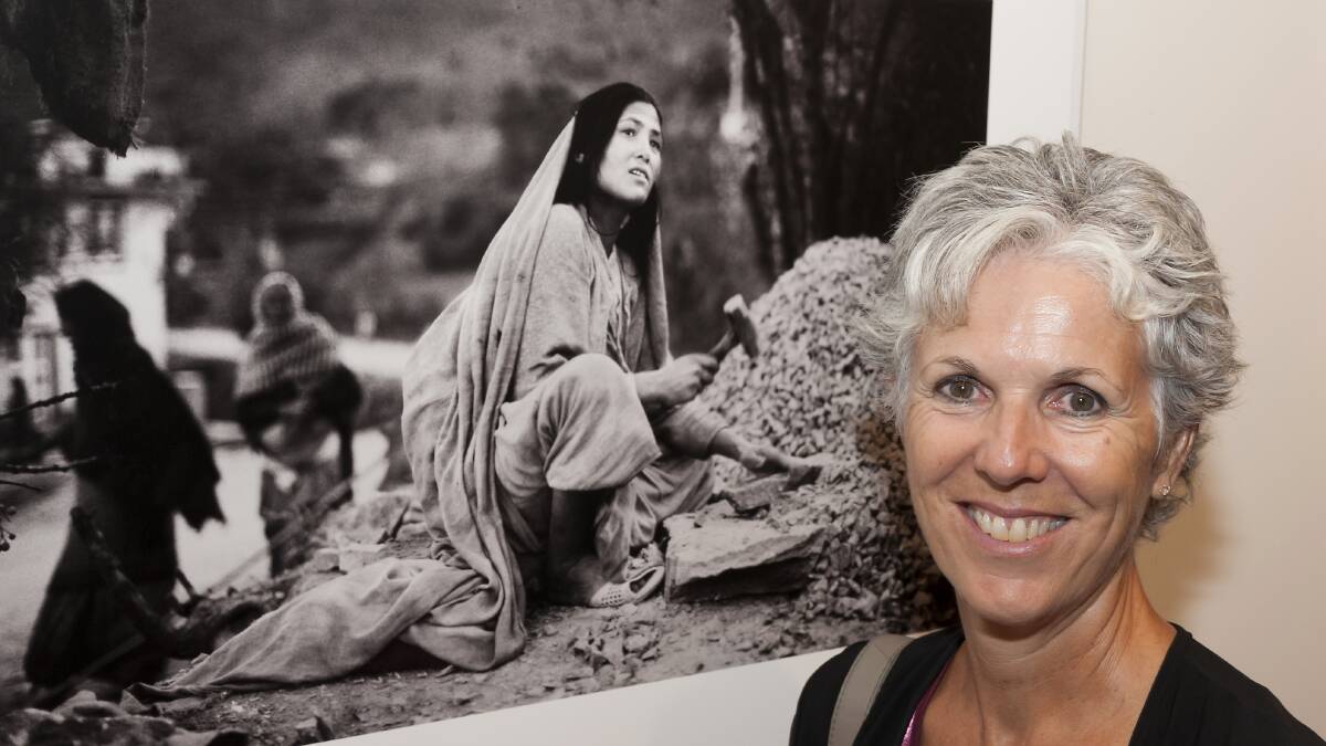 Lyndal Forrest with 'A woman making roadbase' - Nepal 1997. Ashley Cleaver photo.