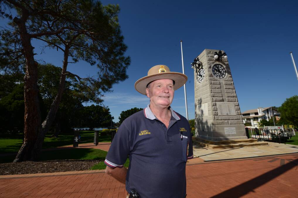 Senior vice president of the RSL sub-branch and chairman of the Taree 2015 Anzac Day planning committee, Darcy Elbourne, stands in front of the refurbished war memorial. 