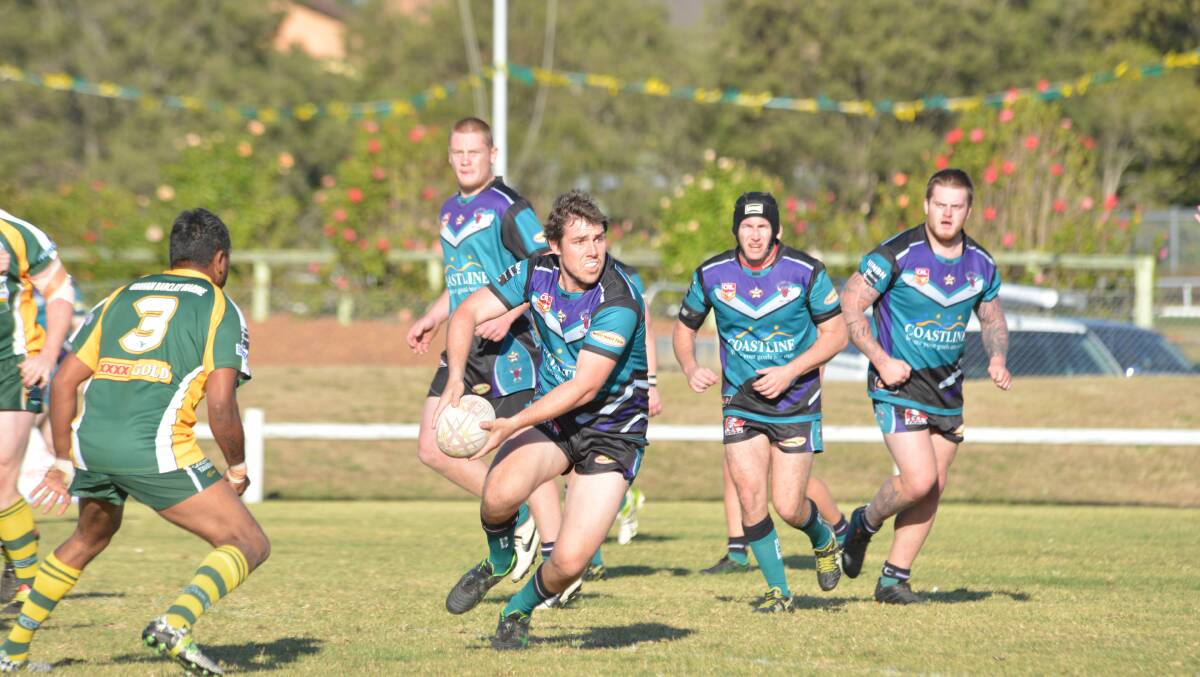 Taree City's Tim Alliston looks to spin the ball wide during the Group Three Rugby League clash against Forster-Tuncurry at the Jack Neal Oval.