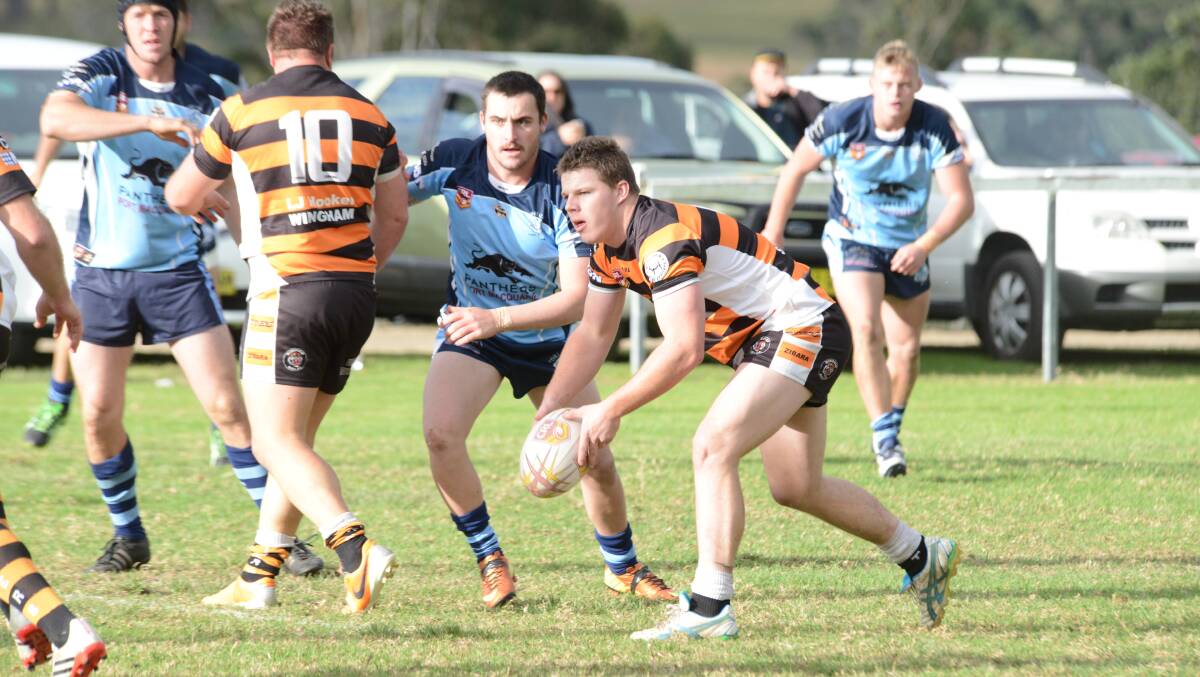 Wingham hooker, Michael Rees throws out a pass during last weekend's loss to Port City in Group Three Rugby League. The Tigers tackle Port Macquarie on Sunday at Port.