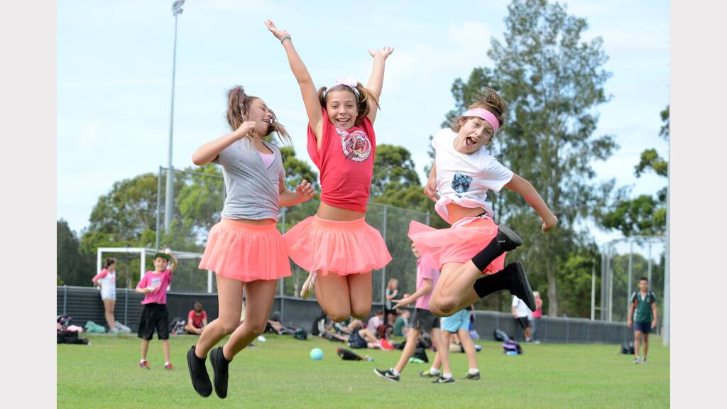 YAY! Miranda Sowter, Amelia Lunney and Trae Gersbach jump for joy at Chatham High's Pink Stumps Day.