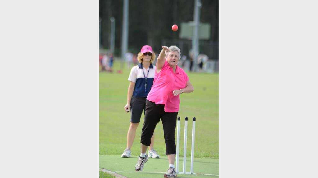 Ms Sue LeStrange bowls under the watchful eye of Mrs Jenny Fotheringham at Chatham High's Pink Stumps Day.
