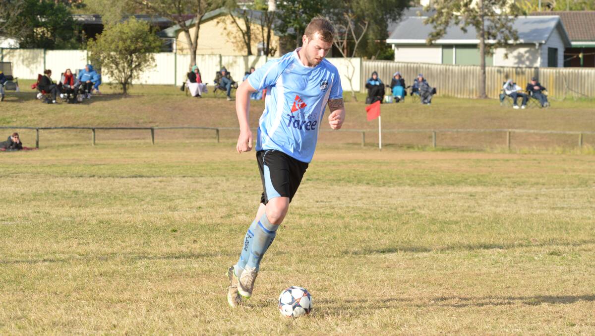 Taree's Rhys Christensen runs the ball during the clash against Camden Haven at Omaru Park. The wildcats went down 3-1.