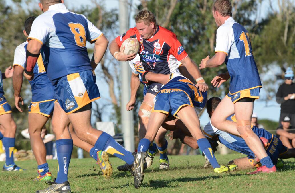 Player of the match, Old Bar prop Rumone Jackson is taken by a Macleay defender during the clash at Old Bar.