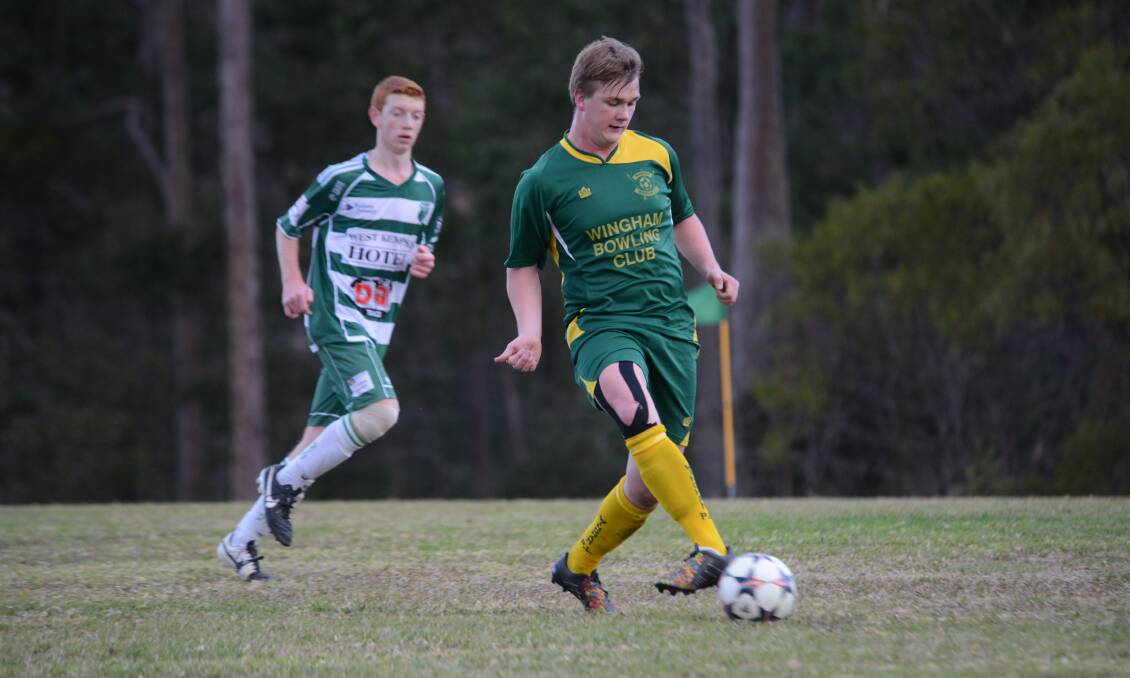 Wingham's Guy Welch sends a pass away during Saturday's game against Kempsey Saints.