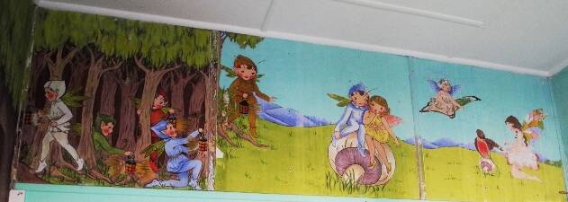 The upper walls of the entrance room of the CWA building has a fairy-land themed mural encircling the room.