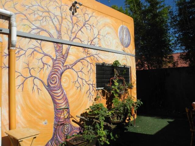 Eye-catching artwork: the mural in the Garden Grub Cafe's garden is a perfect example of how our walls could be transformed.