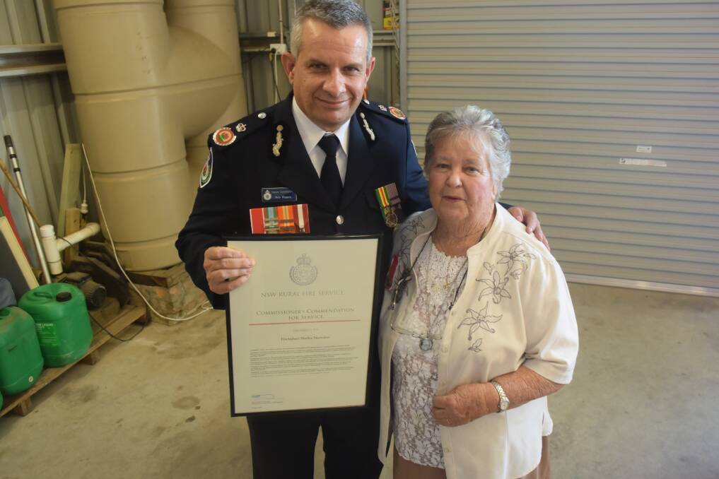 Commendation: NSW Rural Fire Service deputy commissioner Rob Rogers with Shirley Snowden. Photo: Rob Douglas. 