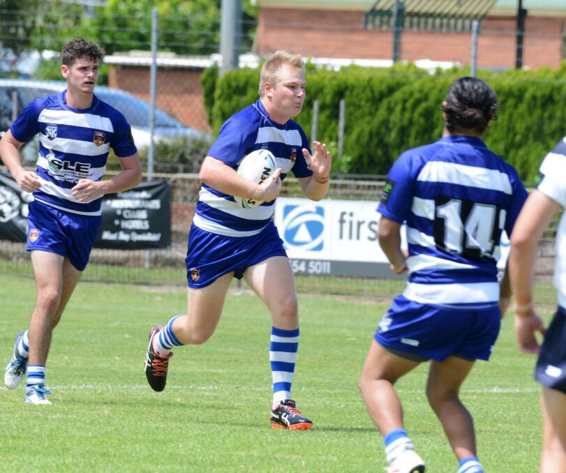 North Coast Bulldogs under 18s forward Casey Morgan takes the ball up against Central Coast at Tuncurry. The side faces a tough challenge against Parramatta tomorrow in Sydney.