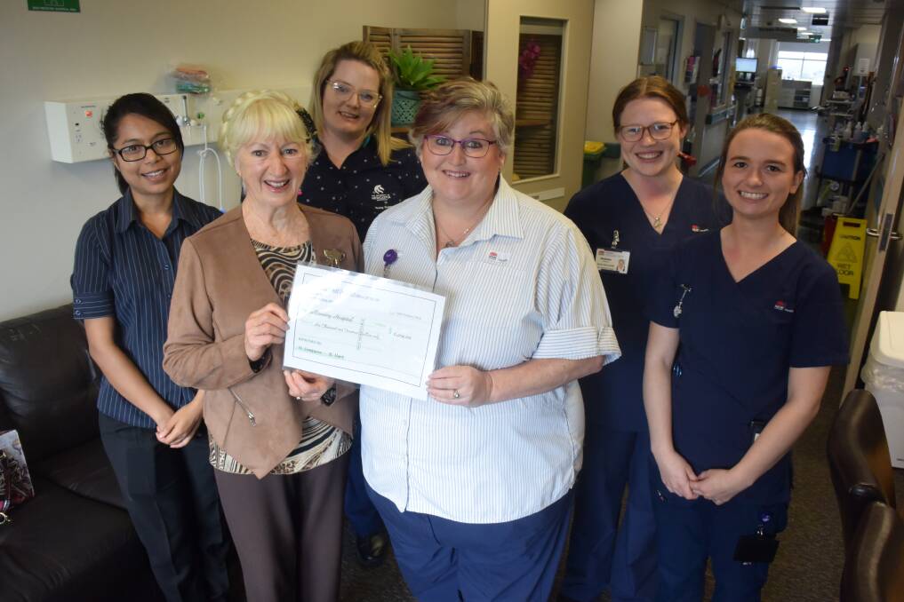 Bunyah Hall president Neryl Simpson presented palliative and cancer care services nursing unit manager Donna Nicholson with the donation. They are pictured with Niki Takhanal, Jessica Bonniface, Madeline Pascoe and Emma Mcloud. 