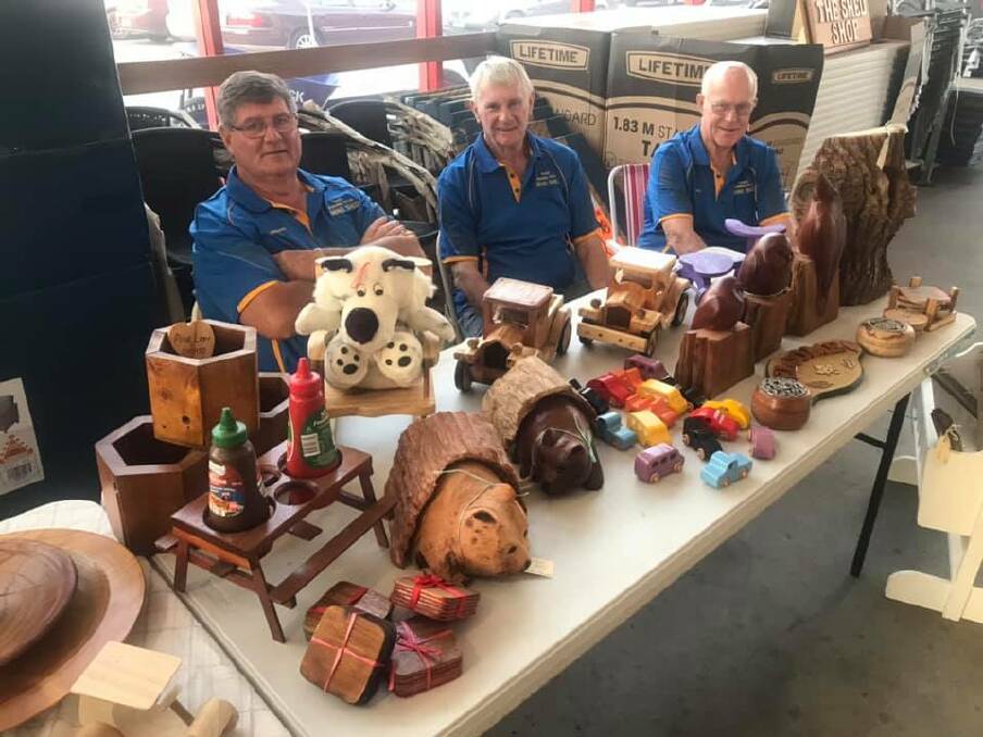 Taree Manning River Mens Shed members pictured selling items. The group has received $5000 in State government funding.