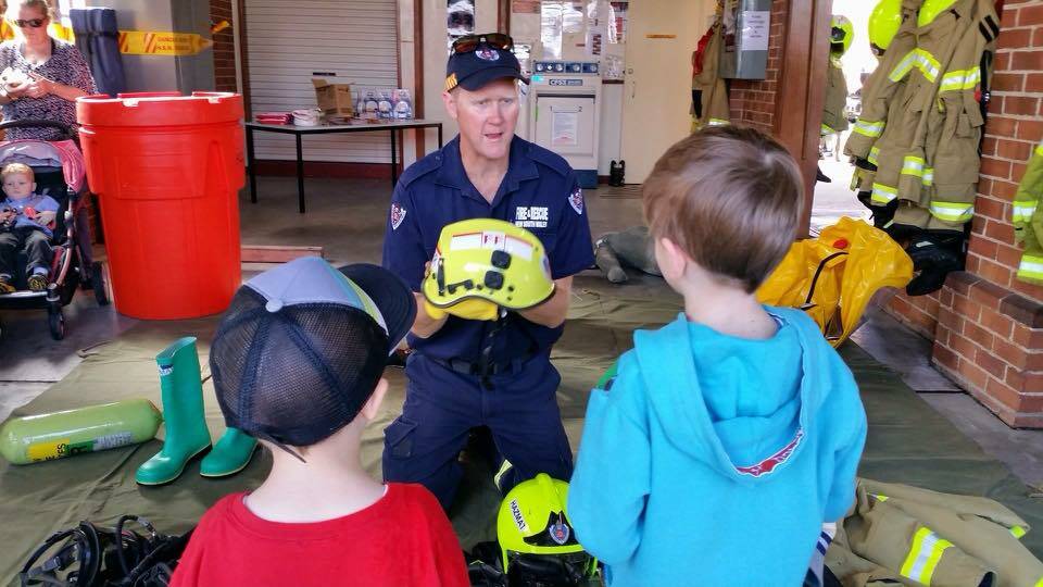 Crew member Nigel Cooper showed off firefighting equipment during last year's Fire and Rescue NSW Open Day in Taree.