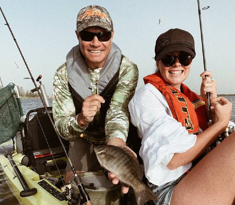 Great catch: 'Escape Fishing with ET' host Andrew Ettingshausen went out on the water with Manning singer Madelyn at Crowdy Head. Photo: supplied. 