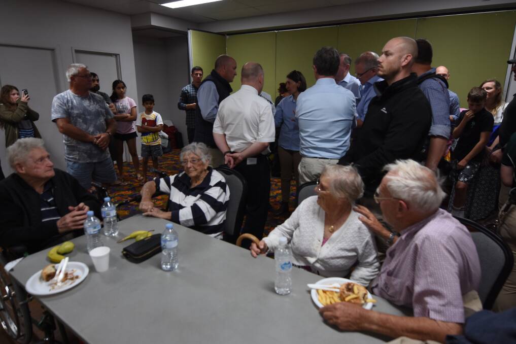 Residents, politicians and emergency personnel inside the evacuation centre at Club Taree last Sunday. Photo: Scott Calvin.