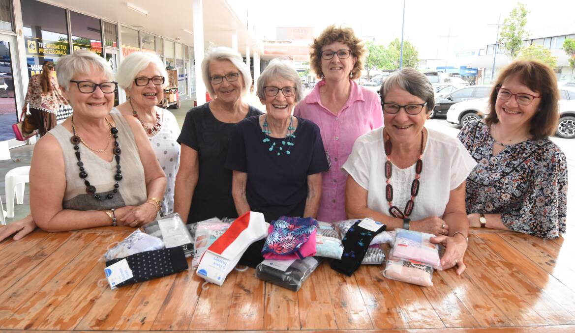 Donations: Jan Shultz, Margaret Grice, Alison Fowler, Joan Forrester, Frances Barberie, Alison McIntosh and Marilyn Thomas with their collection of socks and undies for Orange Sky Laundry. Photo: Scott Calvin. 