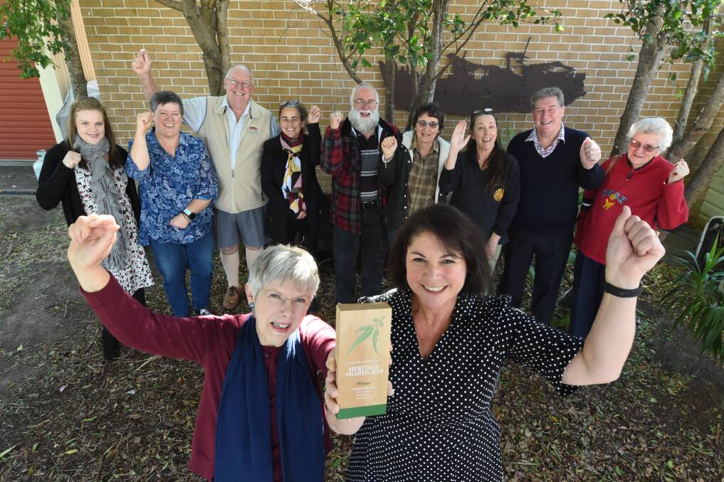 Well done team: Penny Teerman and Janine Roberts (front) with the trophy. They are joined by contributors Merinda Ramage, Sue Calvin, Ken Beeton, Rachel Piercy, Wal Horsburgh, Vicki Fletcher, Rosie Herberte, Les Eastaway and Kay Grace. Photo: Scott Calvin. 