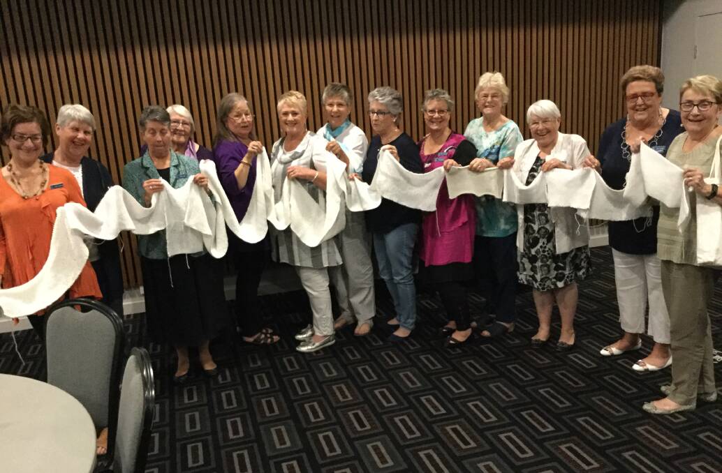 Contributions: Taree Quota Club prepare their knitting for the White Ribbon record attempt on Friday. Photo: supplied.