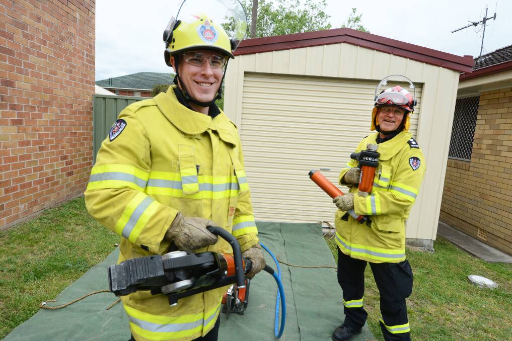 Reliable gear: Taree Fire Station deputy captain Nathan Cooke and commander Peter Willard trained with the new combi and hydraulic ram tools. Photo: Scott Calvin.