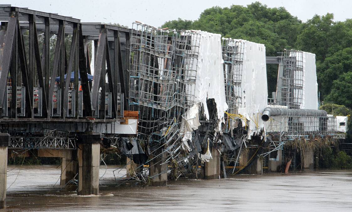 Repair work: Extensive damage to scaffolding on the Martin Bridge was caused by debris during major flooding of the river. Photo: Scott Calvin.