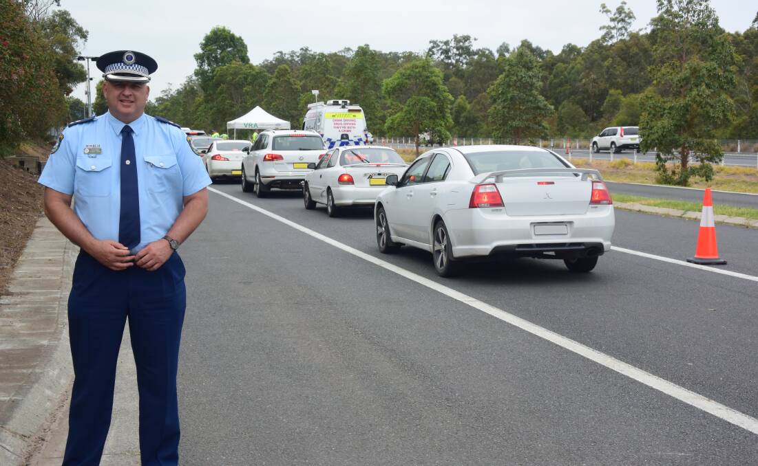 Testing: Manning Great Lakes Police District Commander Superintendent Shane Cribb at the traffic operation south of Taree. Image digitally altered. Photo: Rob Douglas. 