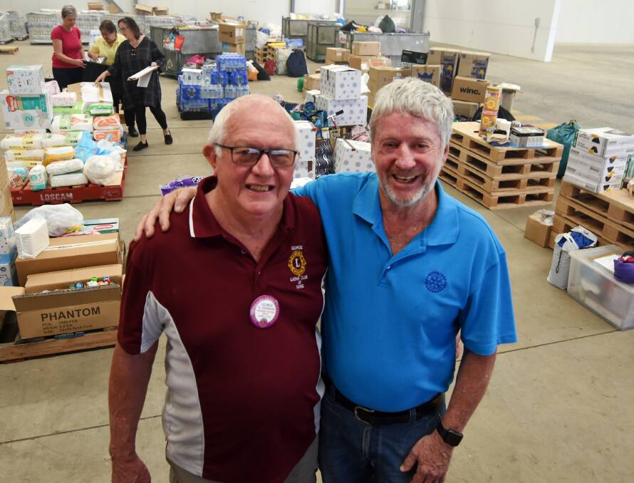 Taree Lions Club president George Greaves and Rotary Club of Taree on Manning projects manager Maurie Stack. The clubs have combined efforts to raise funds for bushfire relief.