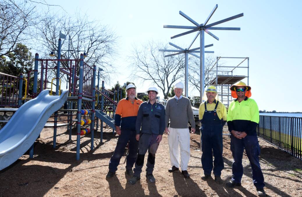 Construction underway: Kim Black, Lee Black, Ken Raison, Rob Cowley and Lee Kavanagh at Queen Elizabeth Park. Shade shelters are being installed at the site. Photo: Scott Calvin. 