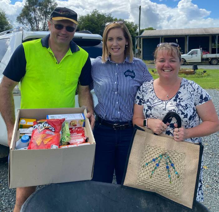 Aussie Helpers chief executive Tash Kocks, pictured with volunteers at Nabiac, said the charity will return to the Manning next week to help 18 more farming families affected by floods. Photo: supplied.