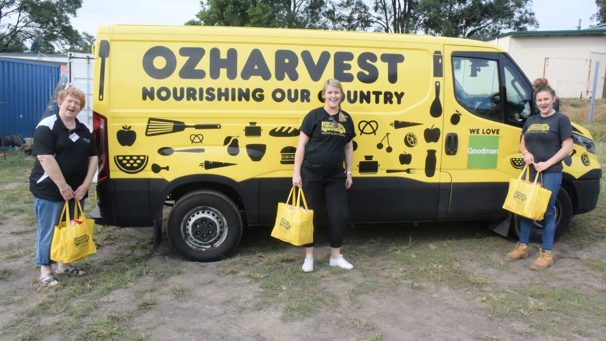 BlazeAid vice president Chris Male welcomed the delivery of 50 hampers from OzHarvest's Nicki Lembcke and Laura Sikais. Photo: Rob Douglas.
