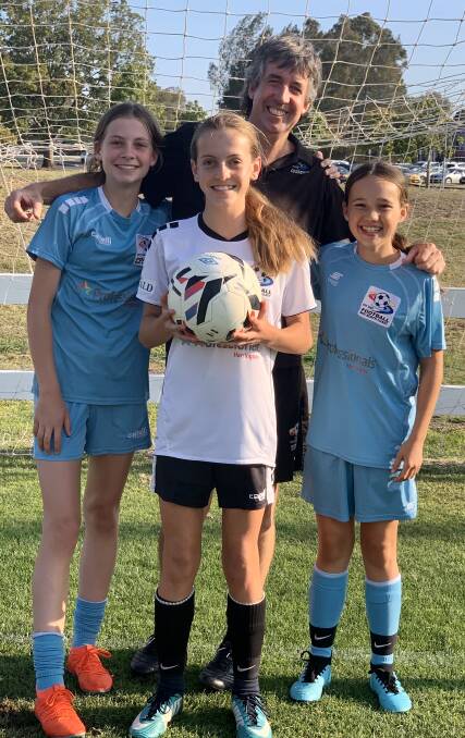 Bound for Fiji: Coach Brenton Doyle with FMNC under 14s Women's Premier League players Jorja Holborow, Emilee Franklin and Chelsea Hackenberg. Brenton will coach the regional NSW side at the 2019 Fiji Cup. Photo: supplied.