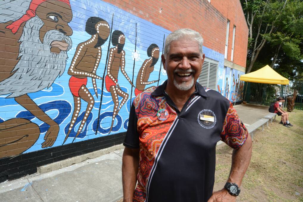 Importance of dance: Uncle Russell Saunders designed the fish mural two years ago. It was painted at Taree High School inline with NAIDOC Week. Photo: Scott Calvin.